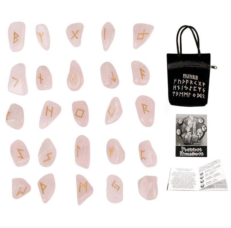 The image showcases a set of 25 intricately carved runes on Rose Quartz, displaying the complete Futhark alphabet. These runes serve as ancient divination tools, blending the gentle, loving energies of Rose Quartz with the profound symbolism of the runic alphabet. They are intended for spiritual seekers and practitioners, offering a pathway to guidance, self-discovery, and emotional healing through their mystical and esoteric significance.